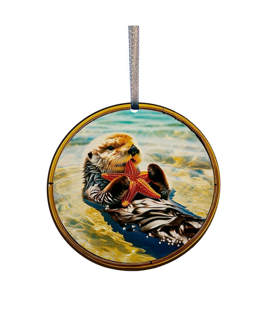suncatcher image of sea otter laying on its back eating a starfish